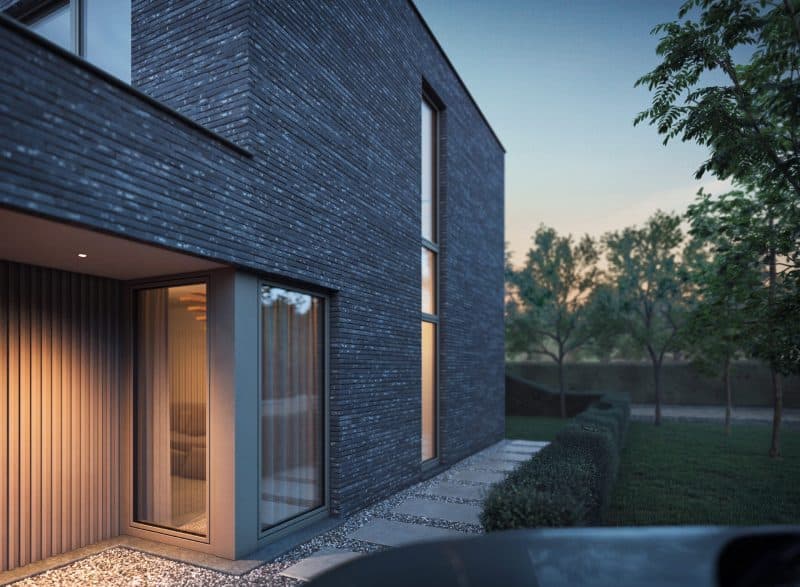 Maison moderne en brique foncée avec fenêtres PVC anthracite